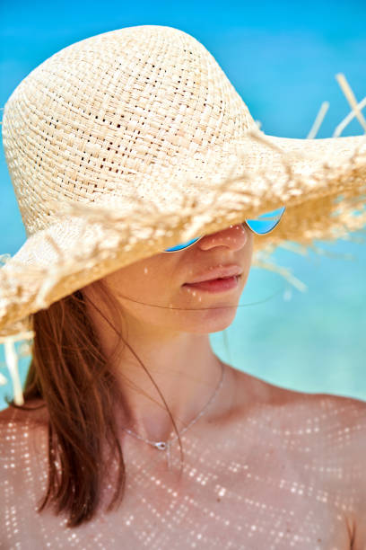 istock Woman in bikini on beach 1136167210