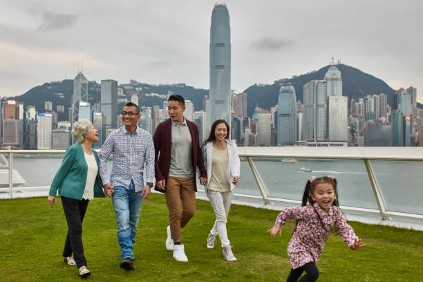 istock Happy family enjoying weekend in park 1136167240