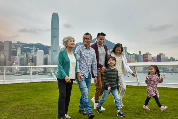 istock Happy multi-generation family walking in park 1136167243