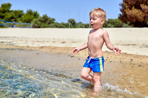 istock Toddler boy on beach 1136167288