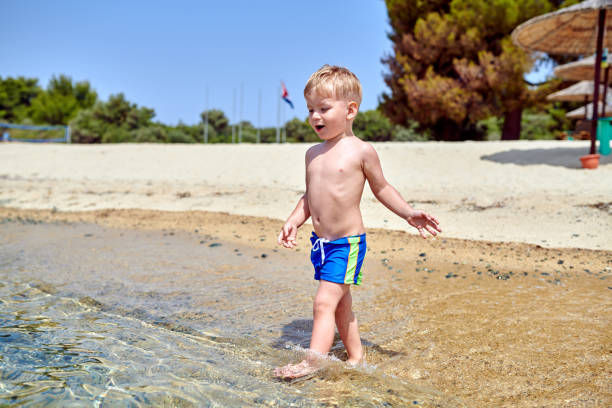 istock Toddler boy on beach 1136167289