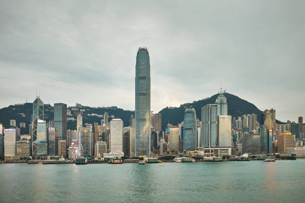 istock Skyscrapers at Victoria Harbour against sky 1136168092