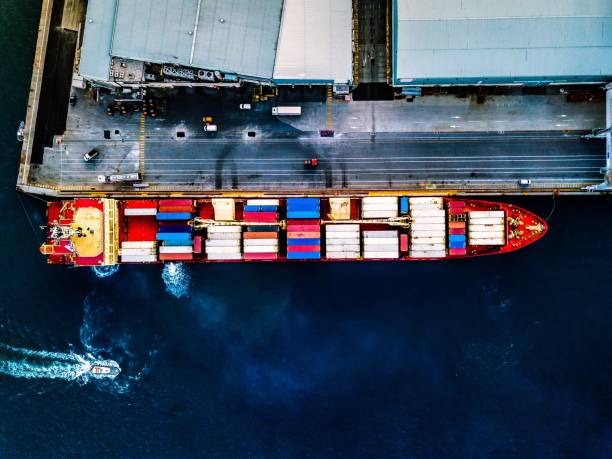 istock Aerial view of container ship at sea port 1136169376