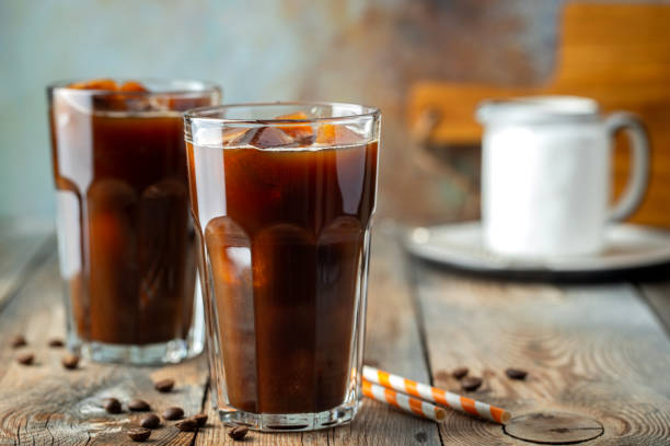 istock Ice coffee in a tall glass with cream. 1136170644