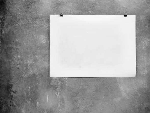 istock Concrete wall and empty white paper,Grunge background 1136170733