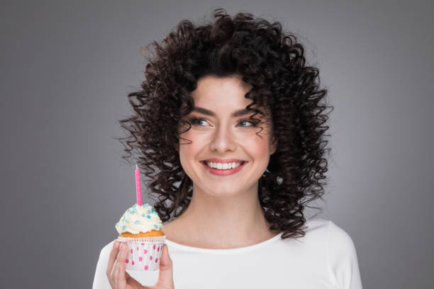 Woman with birthday cupcake
