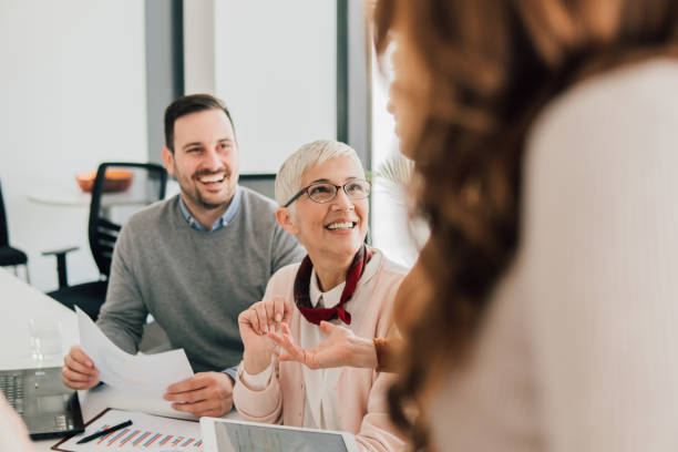 istock Happy coworkers at office 1136172115