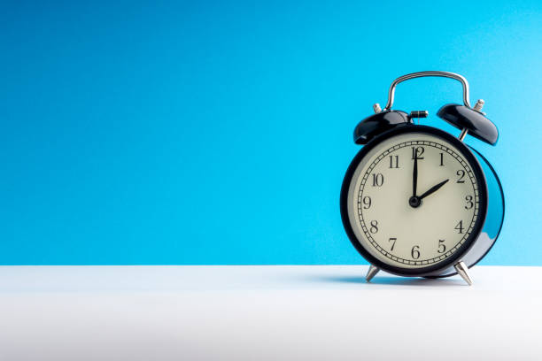 istock Alarm Clock on colorful background with selective focus 1136174929
