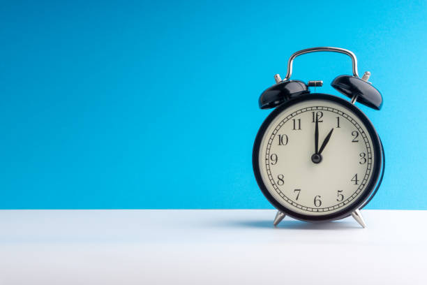 istock Alarm Clock on colorful background with selective focus 1136174968