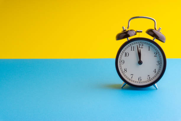istock Alarm Clock on colorful background with selective focus 1136175019