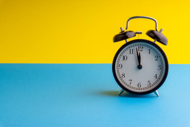 istock Alarm Clock on colorful background with selective focus 1136175144