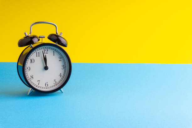 istock Alarm Clock on colorful background with selective focus 1136175256