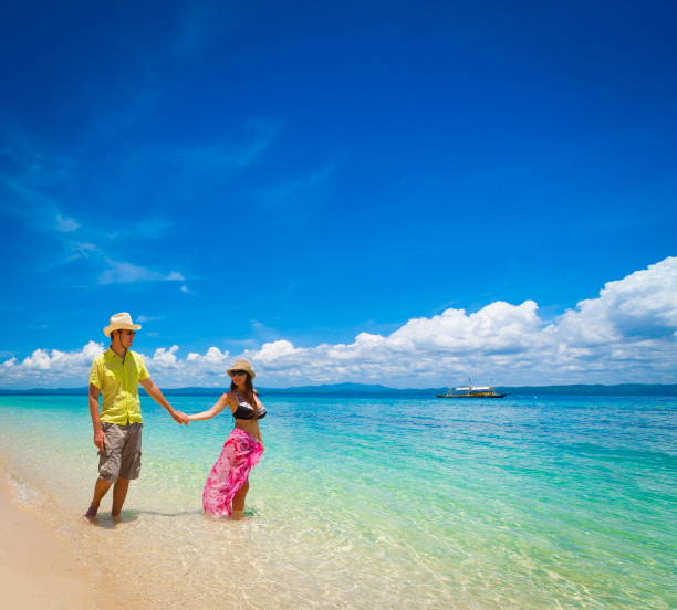 istock Philippines,  woman and man beach 1136176199