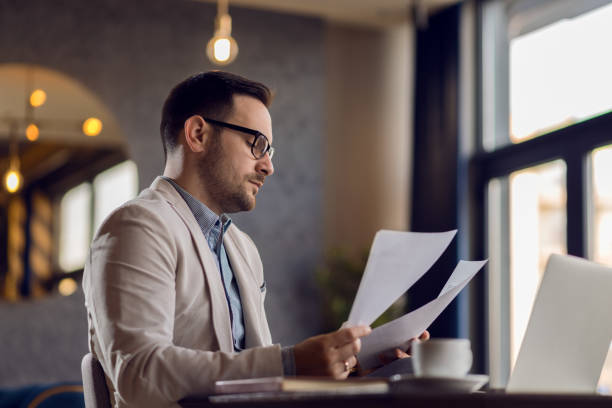 istock Young  businessman working on business reports in the office 1136176205
