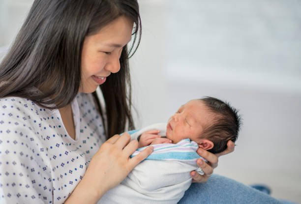 istock Mother And Baby In Bed 1136176280