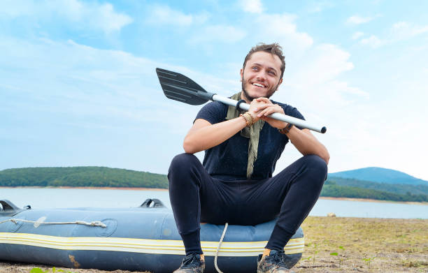 Fisherman taking rowboat to lake