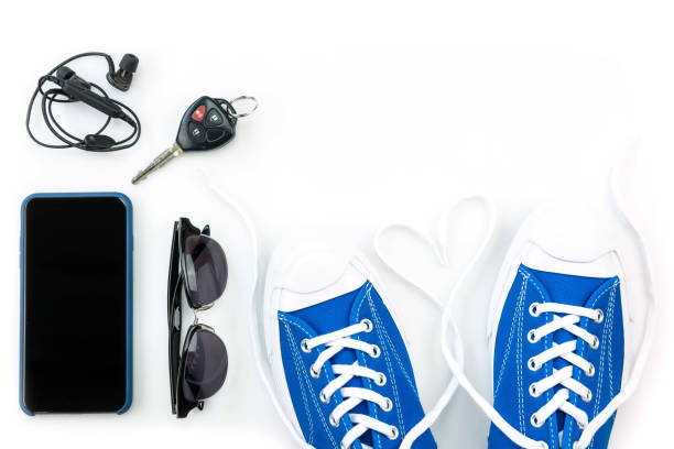 istock sneaker and mobile phone and travel accessories isolated on white background 1136177517
