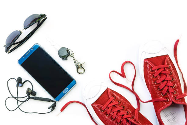 istock sneaker and mobile phone and travel accessories isolated on white background 1136177570