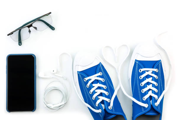 istock sneaker and mobile phone and travel accessories isolated on white background 1136177580