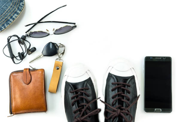 istock sneaker and mobile phone and travel accessories isolated on white background 1136177629