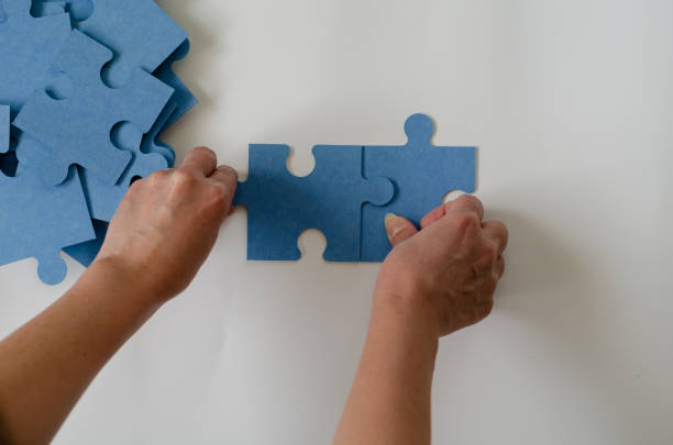 istock Merge  pieces of puzzle 1136177918