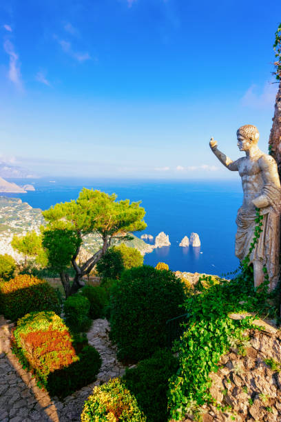 istock Statue and green gardens in Capri Island town 1136178132