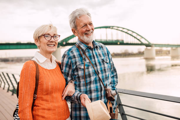 istock Happy old couple walking 1136179081