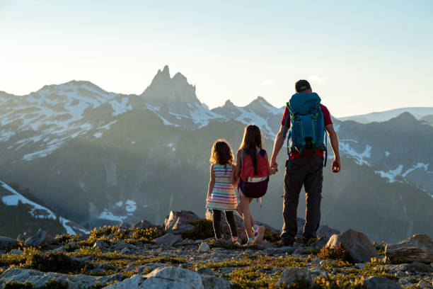 Family sharing a love for the great outdoors Father with young daughters exploring nature canada trip stock pictures, royalty-free photos & images