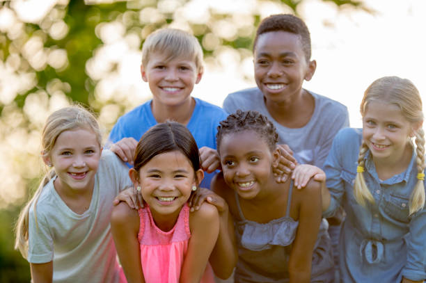 istock Kids Posing For Photo On A Sunny Day 1136179711
