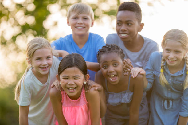 istock Kids Posing For Photo On A Sunny Day 1136179712