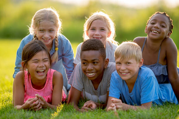 istock Kids Posing For Photo On A Sunny Day 1136179719