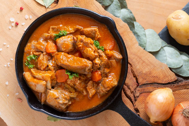 food concept french classic veal stew marengo de veau in skillet iron cast with copy space - veal imagens e fotografias de stock