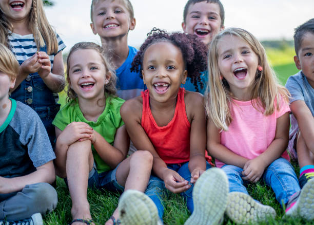 istock Kindergarten kids in a park 1136181095