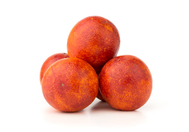 istock Bloody orange on a white background. Several red orange close-up on a white background. 1136181103