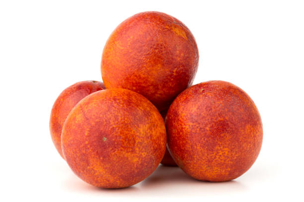 istock Bloody orange on a white background. Several red orange close-up on a white background. 1136181997