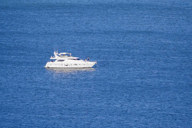 istock Private motor yacht on the blue sea (copy space) 1136182635