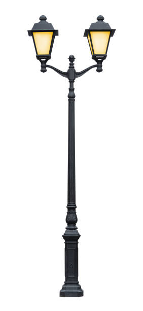 istock Lamp post with light on, isolated on a white background 1136182660