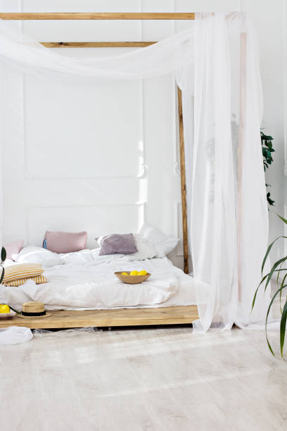 istock Beautiful bright room and a four-poster bed. 1136182768