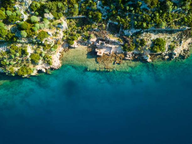 Top Down Aerial View Sunken City Kekova Turkey Top down bird's eye view of Ancient Lycian submerged sunken city of Kekova, Turkey kekova stock pictures, royalty-free photos & images