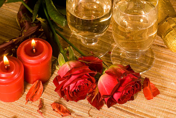 istock scarlet sweetheart rose and candle 113618514