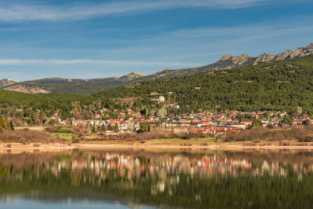 the city of navacerrada reflected in its pond. Spain Madrid Guadarrama. stock photo