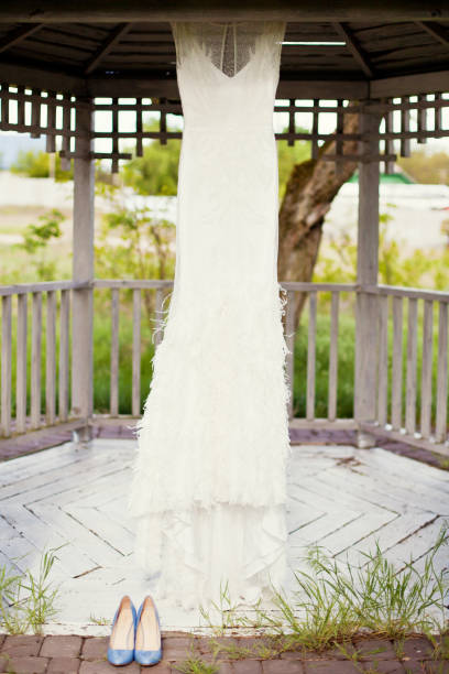 istock vintage wedding dress and blue shoes 1136186484