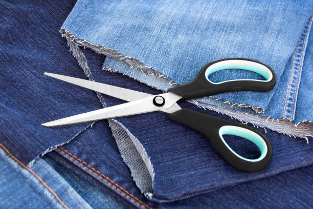 jeans and scissors close up - short cut imagens e fotografias de stock
