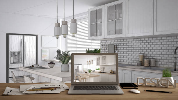 istock Architect designer desktop concept, laptop on wooden work desk with screen showing interior design project, blueprint draft background, modern scandinavian kitchen with wooden details 1136190047