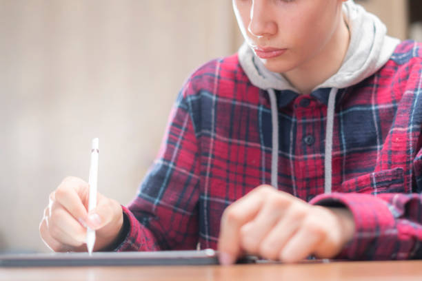 istock young male artist draw on digital tablet in studio 1136190127
