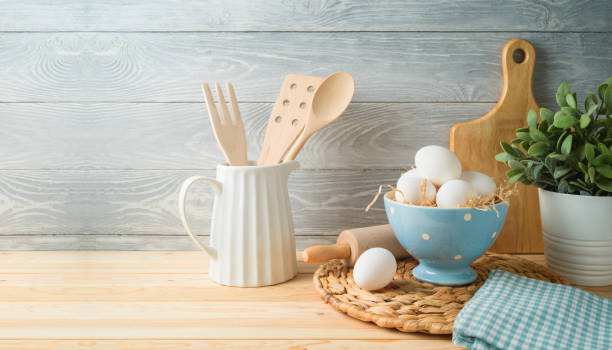 istock Easter baking background with eggs and kitchen utensils on wooden table 1136190427