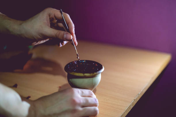 istock the process of mixing tabacco for hookah in bowl 1136190477