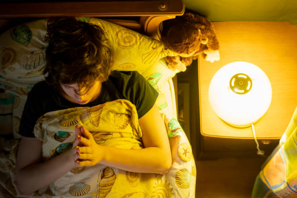 istock young man pray in bed at night b 1136191375