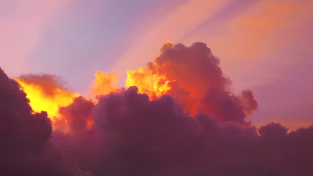 Time lapse video of awesome changing cloudscape at sunset in 4K