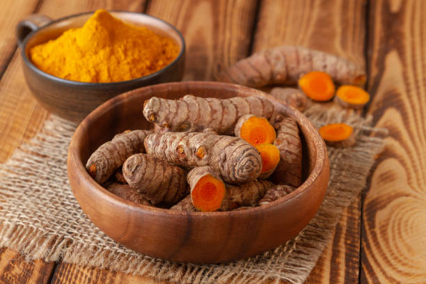 istock Turmeric roots rhizome and powder 1136198515